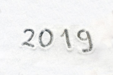 2019 written on the snow-covered windowsill. Happy new 2019 year