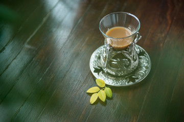 coffe in vintage turkish cup on wooden background top view