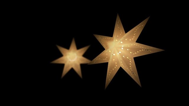 Two christmas star paper lanterns shining and glowing with warm light in yellow color on a black background. The star light slowly rotates from left to right. 3D rendered with a seamless loop.