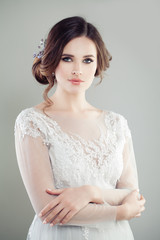 Romantic bride with makeup, bridal hairstyle and wedding dress