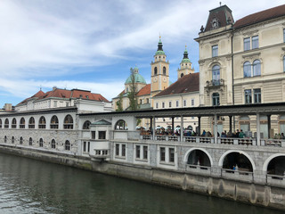Fototapeta na wymiar Ljubljanica river with the Ljubljana Cathedral