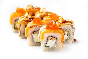 Closeip image of classic philadelphia sushi rolls with salmon, cream cheese, eel and red caviar isolated at white background.