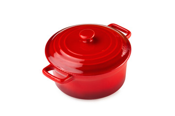 Red ceramic saucepan with cover isolated at white background.