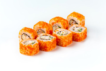 Closeup california sushi rolls with tobiko caviar, crab and cucumber isolated at white background.