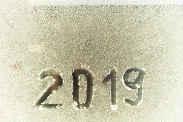 2019 inscription on the glass by hoarfrost.
