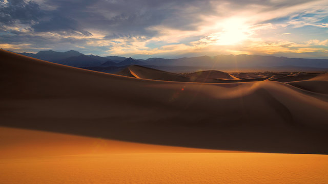 Desert sand dunes at sunrise