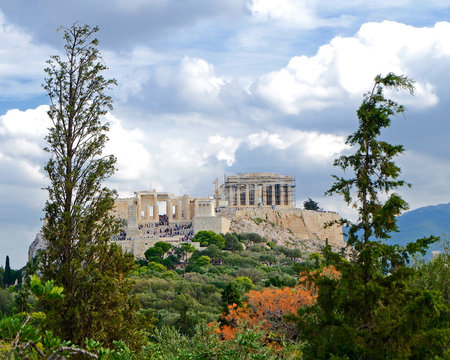 Acropolis of Athens Greece under a blue cloudy sky, view from Pnyx hill