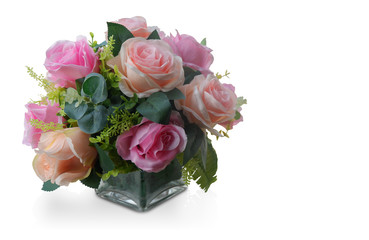 Di cut pink and orange roses bouquet in glass vase on white background,copy space