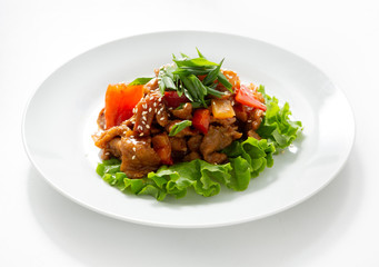 Vegetables with meat in a plate on a white background