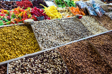Different nuts on wooden counter for sale at market in Georgia