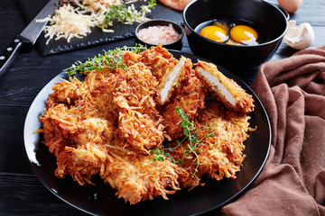 chops coated with grated potato and cheese