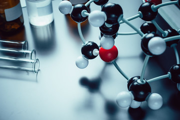molecular formula and laboratory equipment on a blue background with copy space. Science organic...