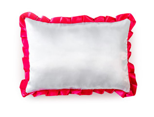 White pillow with pink frill isolated on a white background