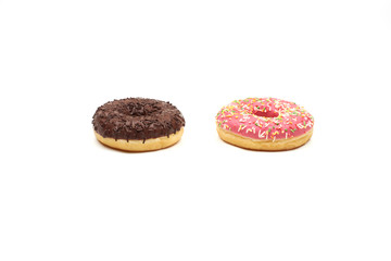 Tasty chocolate donut and Pink donut with colorful sprinkles on white background