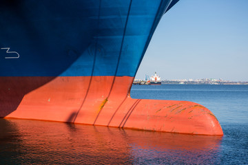 container ship close - up. Part of large merchant ship. Bulb