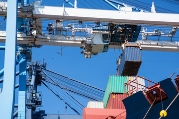 Fototapeta premium industrial port with containers. Container terminal of industrial port with cranes and ships at work