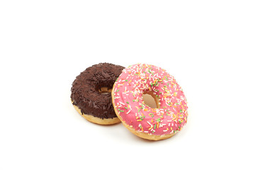 Tasty chocolate donut and Pink donut with colorful sprinkles on white background