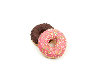 Tasty chocolate donut and Pink donut with colorful sprinkles on white background