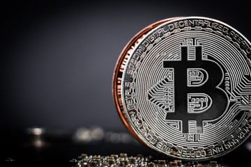 Fototapeta na wymiar Silver bitcoin coin close-up. Bitcoin logo on the dark background. Digital money concept