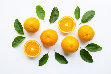 Fresh orange citrus fruit with leaves isolated on white wooden background.  Top view