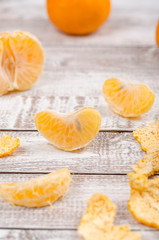 Peeled tangerin on wooden background