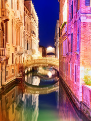 Fototapeta na wymiar Picturesque canal with bright colorful buildings and little bridge