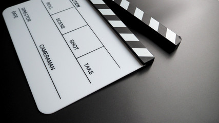 White Clapper board or movie slate or clap board. that use in video production , film, cinema industry. On black back ground.