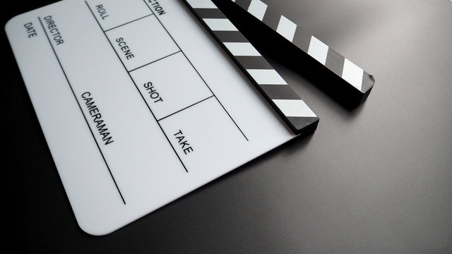 White Clapper board or movie slate or clap board. that use in video production , film, cinema industry. On black back ground.