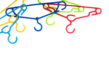 set of colorful plastic clothes hangers isolated on a white background