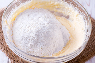 Flour in a bowl with dough