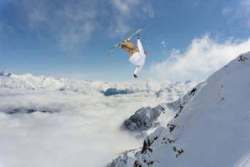 Naklejka na ściany i meble Flying skier on snowy mountains. Extreme winter sport, alpine ski. Copy space.