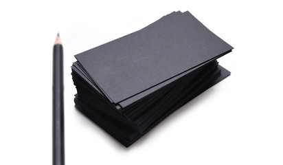 black business cards with pencil isolated on a white background