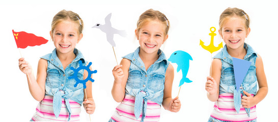 Set of little smiling blond girl holdind colorful toys on sticks isolated on white background