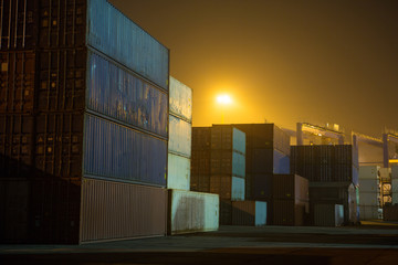 industrial port with stack containers in night time