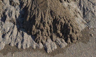 Sand forming patterns on beach from stream outlet. North Devon, England
