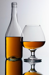 BRANDY BOTTLE AND GLASS