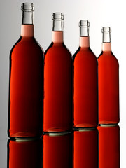 FOUR RED WINE BOTTLES