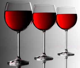 THREE RED WINE GLASSES