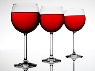 THREE RED WINE GLASSES