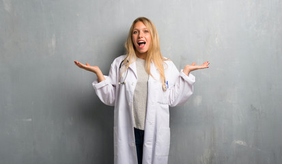 Young doctor woman with surprise expression because not expect what has happened
