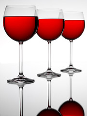 THREE RED WINE GLASSES