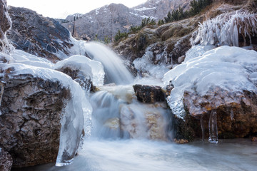 Dolomites spring water with ice formations