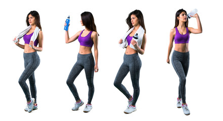 Fototapeta premium Set of Young sport girl with a bottle and towel