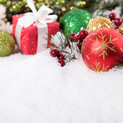 Christmas border with decorations and gift on the snow square