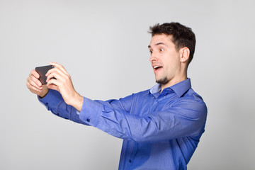 Smiling man making photo