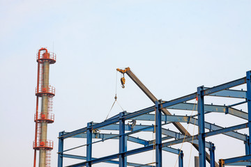 Fototapeta na wymiar Workers installing steel frame in a factory, China