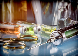 Different vials and utensils in an operating theater, conceptual image