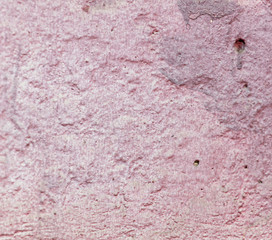 Old wall painted with pink paint as a background