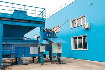 A site for loading waste into containers at a waste sorting and recycling plant. The control panel...