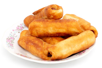 Sausage dough in a plate on a white background